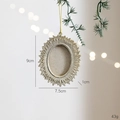 Vintage oval photo frame Christmas ornament in champagne gold hanging on a festive tree - Champagne Resin Oval Frame