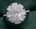 Stunning silver ring with oval moissanite center stone on dark green velvet - US 5 / Flower Halo 2ct-Silver