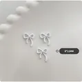 Three pieces of white resin bow nail charms in a 8x11mm size for DIY manicure decoration - Large-White
