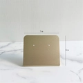 Detail shot of matte gold earring display stand with 7cm width and 6cm height dimensions - L-Shape Small