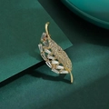 Elegant gold leaf brooch with baguette-cut rhinestones on dark emerald background - 325# Leaves