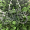 Detail of acrylic Merry Christmas hanging ornament on a festive green Christmas tree branch - 15CM Transparent Hook Letters (1PC)