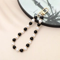 Detailed view of handmade beaded phone strap with black, white, and gold beads and metal clasp - Black Natural Stone Beaded Charm (K3500)