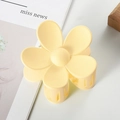 Matte yellow flower hair claw clip displayed on a minimalist magazine background - 7cm / Light Yellow