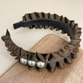Detail of brown pleated headband with three large pearls and sparkling rhinestone trim - Coffee