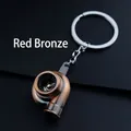 Antique red metal turbocharger keychain featuring a detailed miniature turbine and ring - Red Bronze Turbo