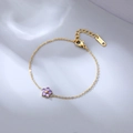 Bracelet élégant à chaîne dorée avec un pendentif fleur violette en acier inoxydable poli - Or avec zircon violet