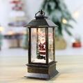 Vintage bronze Christmas lantern with Santa Claus figurine and LED glowing light - Interior Santa Claus