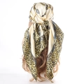 Champagne leopard print satin square scarf worn as a stylish headscarf back view - Yellow Border Leopard