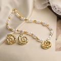 Vintage pearl necklace and spiral gold earrings jewelry set on elegant beige silk fabric - Gold Smooth Hammered Conch Pearl Set