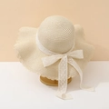 Detail of the white lace bow and wavy edge on this beige straw sun hat for women - Adult 55-58cm / Bow Style / Beige