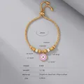 Gold plated evil eye bracelet with purple enamel heart and sparkling zircon accents - E448-Gold Color Bracelet