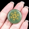 Green crystal agate disc with gold Metatron's Cube sacred geometry symbol detail - Green Aventurine