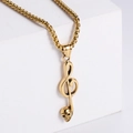 Polished gold music note skull pendant necklace hanging on white geometric block - Gold (No Chain)