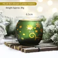 Green Christmas glass candle holder with gold snowflakes on a rustic bamboo mat - Frosted Green (Golden Swirl)