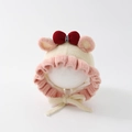 Dettaglio del cappello in maglia per neonati con fiocco rosa e bordi a balze - 50cm(1-2 Anni) / Beige