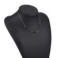 Bohemian gold chain necklace featuring black beads and geometric metal accents - Black Morse Code Style Beads