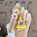 Cute Capybara keychain with yellow sunglasses, mini duck, and brown logo wrist strap - Capybara with Chick Swimming Ring