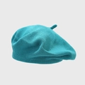 Detailed texture of a teal knitted cotton beret with a classic top stem design - One Size / Teal