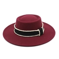 Detail of wine red wool felt fedora featuring a black ribbon and white pearl bead trim - Burgundy