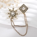 Detail of vintage gold snowflake brooch with pearls, rhinestones and double chains - TL006-Brown-Snowflake
