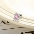 Silver bow heart stud earring with pink zircon drop stone on a ceramic dish - Pink (Single Piece)