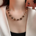 Detail of tiger eye stone necklace with gold metal clasp on model neck - 12# Necklace-Gold-Brown-Real Gold Plated