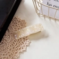 Pearlescent wavy acetate hair clip with pearl embellishments in creamy white finish - 7cm / Iridescent White