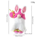 Pink Easter gnome plush with long rabbit ears and carrot detail on a white background - Rose Red