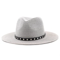 Detail of light gray straw fedora hat featuring a black leather band with silver metal studs - Gray