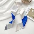 Blue and white abstract print skinny silk scarf styled with French aesthetic props - Sailing Girl