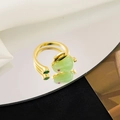 Golden rotatable rabbit ring with green jade stone and red eye detail on mirror - Jade Rabbit Style (H016)