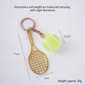 Golden tennis racket keychain with yellow ball and metallic sports style finish - 2.5cm Large Fluorescent Green Tennis Ball + Gold Racket