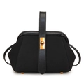 Close-up of elegant black shell bag with golden twist lock and leather handle detail - Black