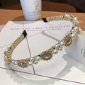 Close-up of golden wired headband featuring baroque pearls and sparkling rhinestones - Antique Gold Sun Rhinestone