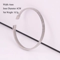 Silver woven stainless steel cuff bracelet with 6mm width and spring coil texture - Steel 8