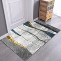 Modern abstract door mat with gray, blue, and gold patterns on a soft short-pile fabric - Creative Ripple