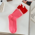 Pink and red colorblock crew socks featuring ribbed knit texture and VT brand labels - One Size / Deep Pink