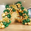 Detail view of dark green and metallic gold balloon arch with a golden star balloon - Dark Green