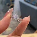 Macro shot of a classic six-prong solitaire ring with a round brilliant cut zircon - TJZ212-Classic Round Solitaire