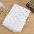 Close-up of double-layer cotton baby blanket with grey stars, moon and white tassels - Moon & Star