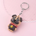 Cute pug dog keychain with brown silicone charm and silver ring on pink background - Pug Dog