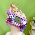 Purple mini handheld game console keychain with golden key ring and purple bell accessory - Marvel Game Console - Purple