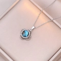 Macro view of rotating flower pendant with starry blue gemstone and silver chain - X1204 Steel Planet Rotating
