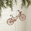 Champagne glitter bicycle Christmas ornament with silver string on pine branch - Bicycle