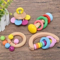Montessori wooden rattle set with colorful beads and natural wood shapes for baby learning - Triple Ring Hand Rattle
