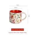 Floral ceramic 450ml mug with orange interior and handle, 14cm wide by 9cm high - Red