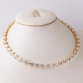 Detailed view of elegant gold-tone necklace with heart and drop zircon on mannequin - Water Drop Zirconia Style A / Gold