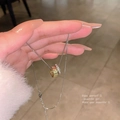 Detail showing intertwined gold and silver rings pendant on a delicate chain necklace - Silver (Double Ring)
