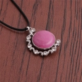 Detailed shot of pink crystal pendant with silver moon-star frame and black rope cord - Pink/Black Rope
